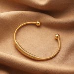 Gold Open Cable Cuff with Polished Ball Ends | Sleek Modern Design - Image 3