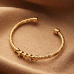 Gold Twisted Cable Stainless Steel Bangle – Crystal Wrap, Bold Elegance - Image 3