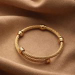 Gold Dual Cable Stainless Steel Bangle – Modern Sphere Design, Sleek Elegance - Image 3